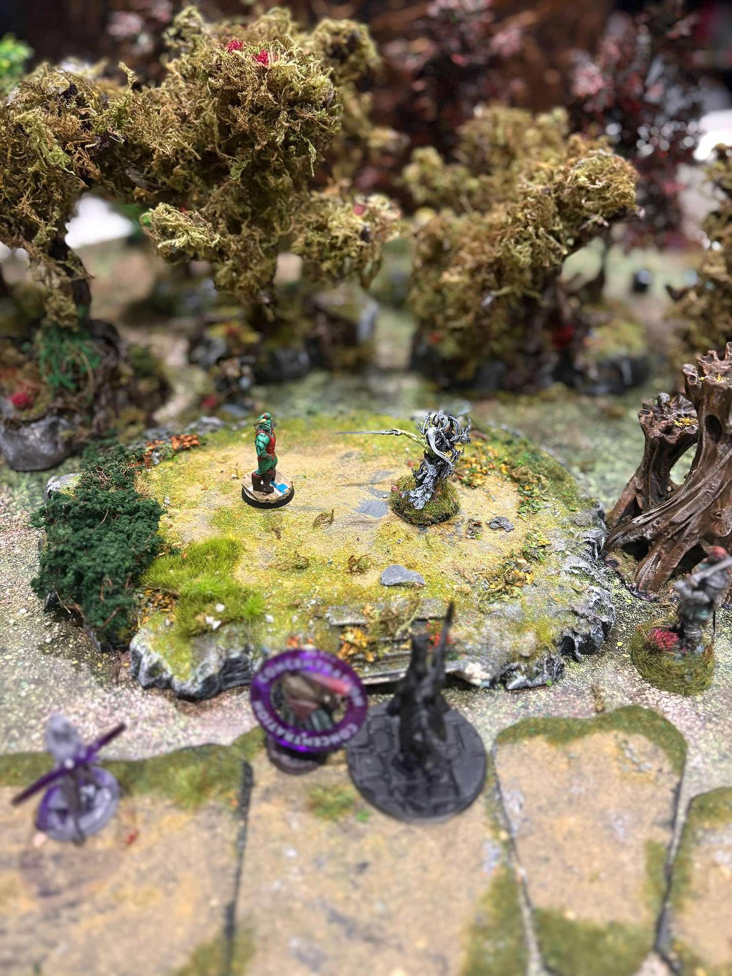 A dragon miniature beside a fire spell template mid-battle
