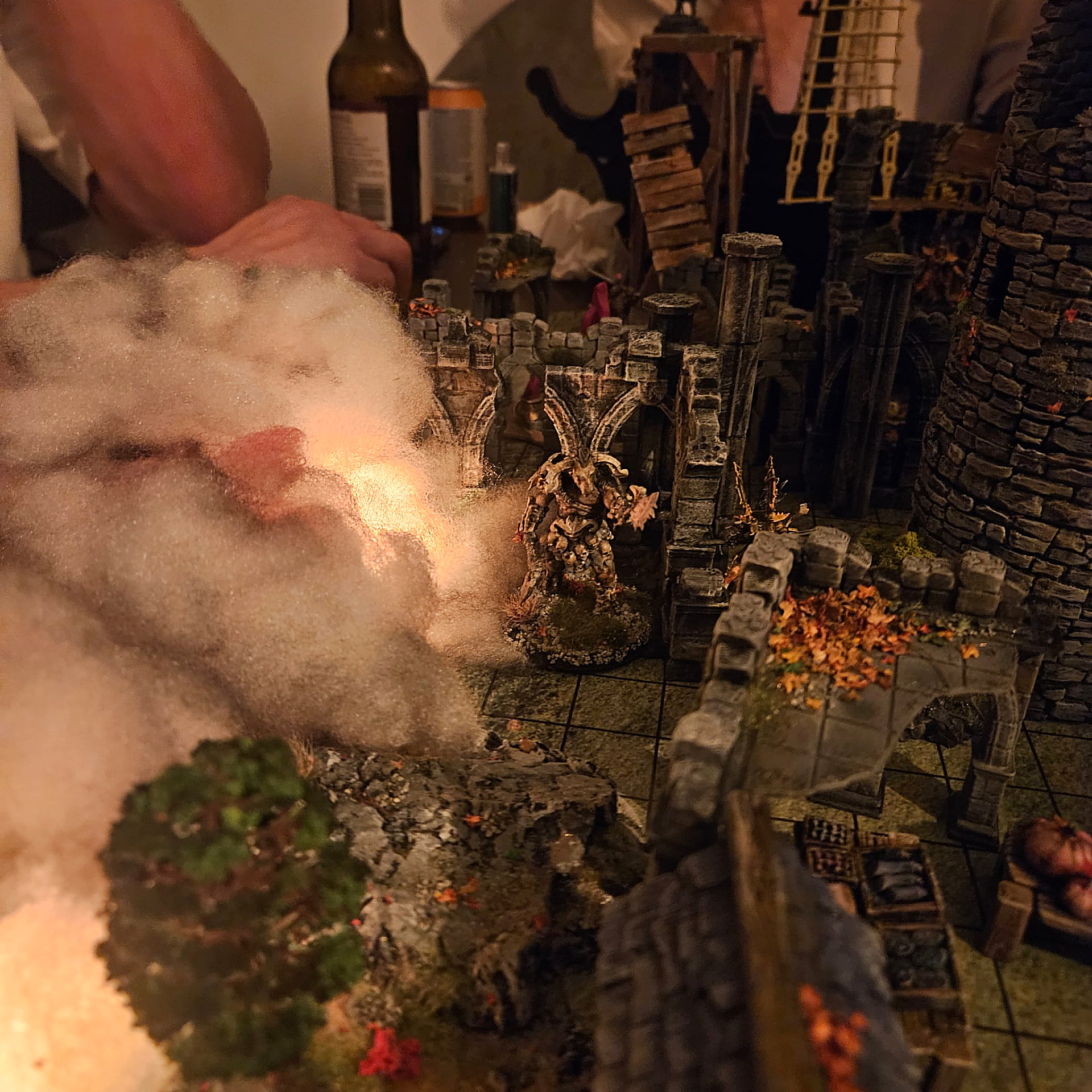 A mist-filled dungeon corridor with a skeletal figure and autumn leaves
