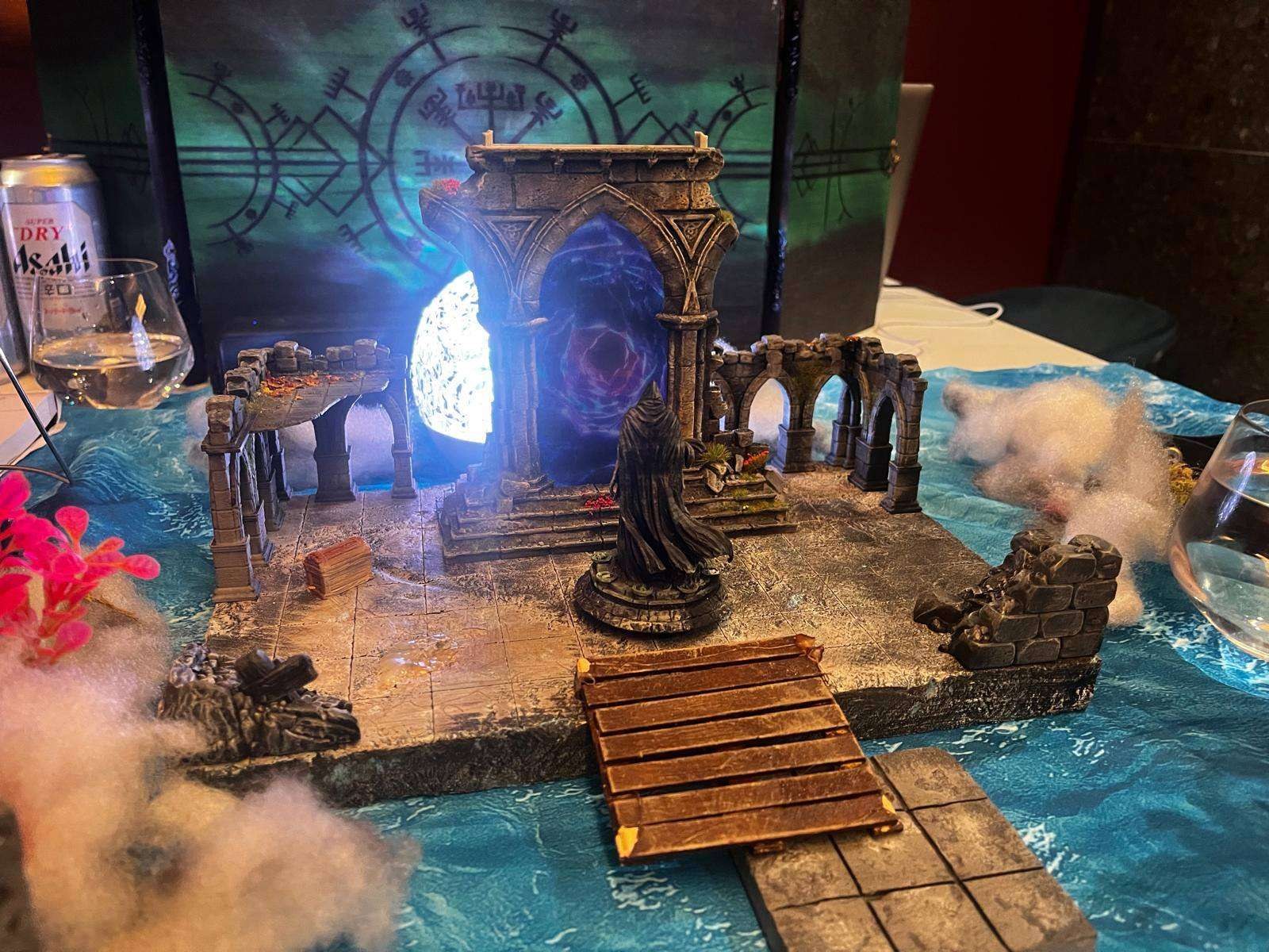 A glowing dungeon door on the modular terrain set