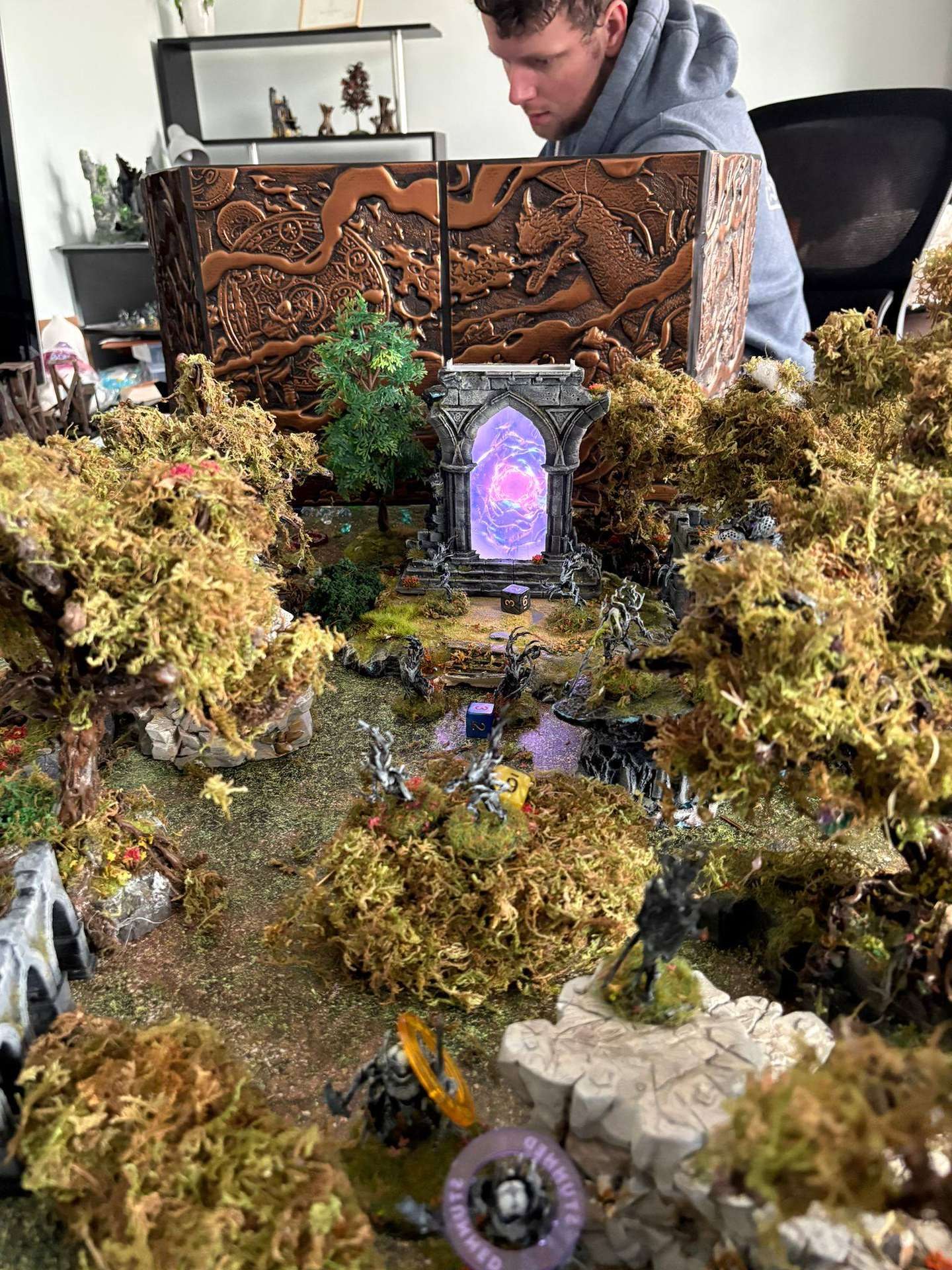 A graveyard scene with a glowing purple portal