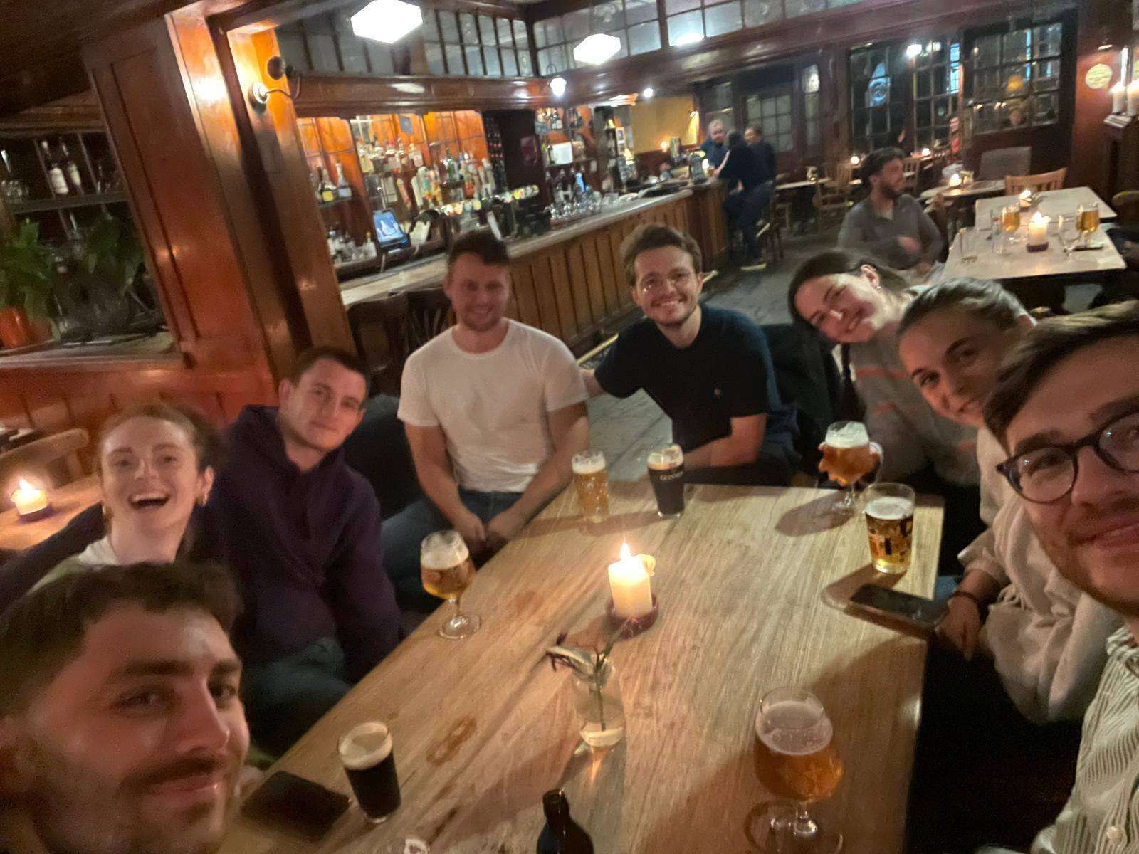 A group of players gathered around the table mid-game