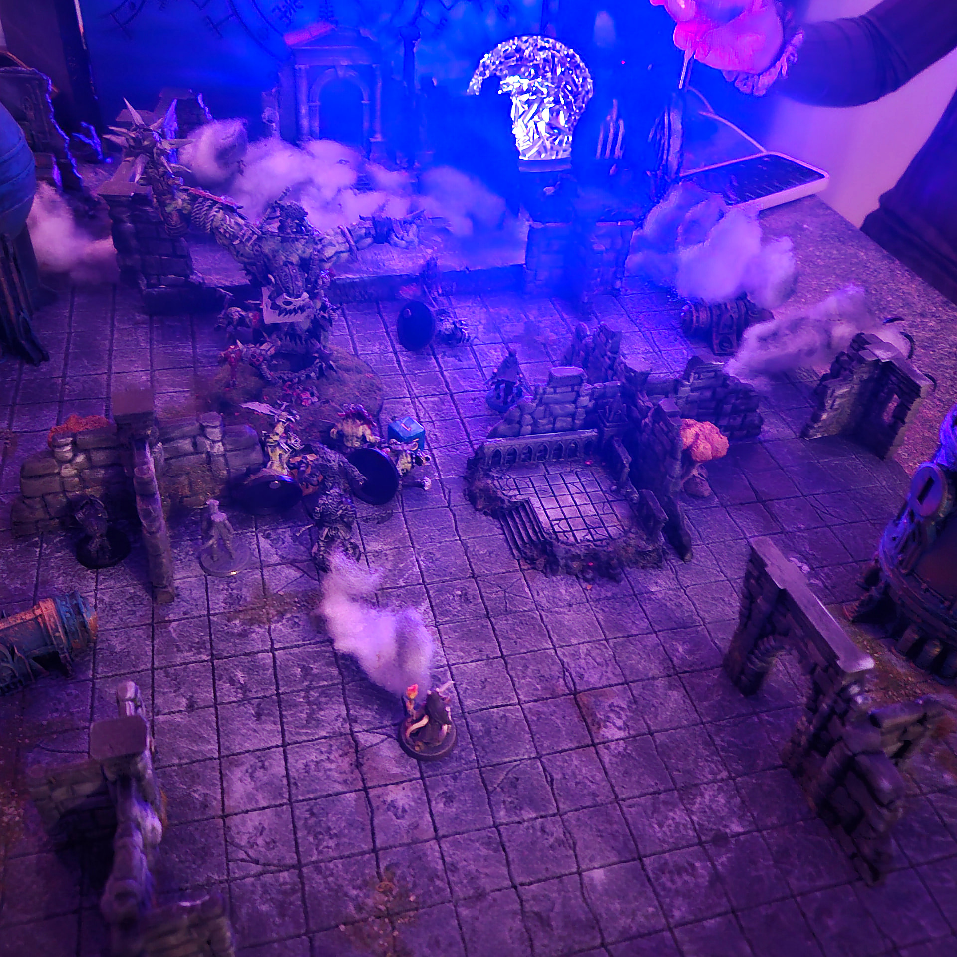 A violet-lit dungeon corridor with a spectral figure looming over the party